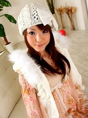Hot babe Fuwari poses on the couch