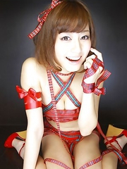 Yumi Sugimoto Asian shows sexy legs in red outfit and sandals