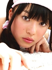 Tomoe Yamanaka in pink maid uniform plays with teddy bea