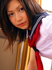 Kaori Ishii is naughty and shows legs under uniform skirt