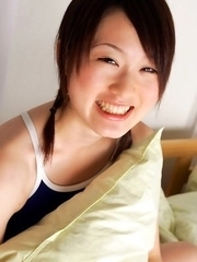 Naoko Sawano in swimsuit puts pillow between her sexy legs