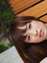 Maho Kiruma shows sexy curves in bath suit in her garden