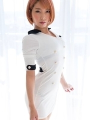 Short-haired stunner Chie Kobayashi strips and shows off her young pussy